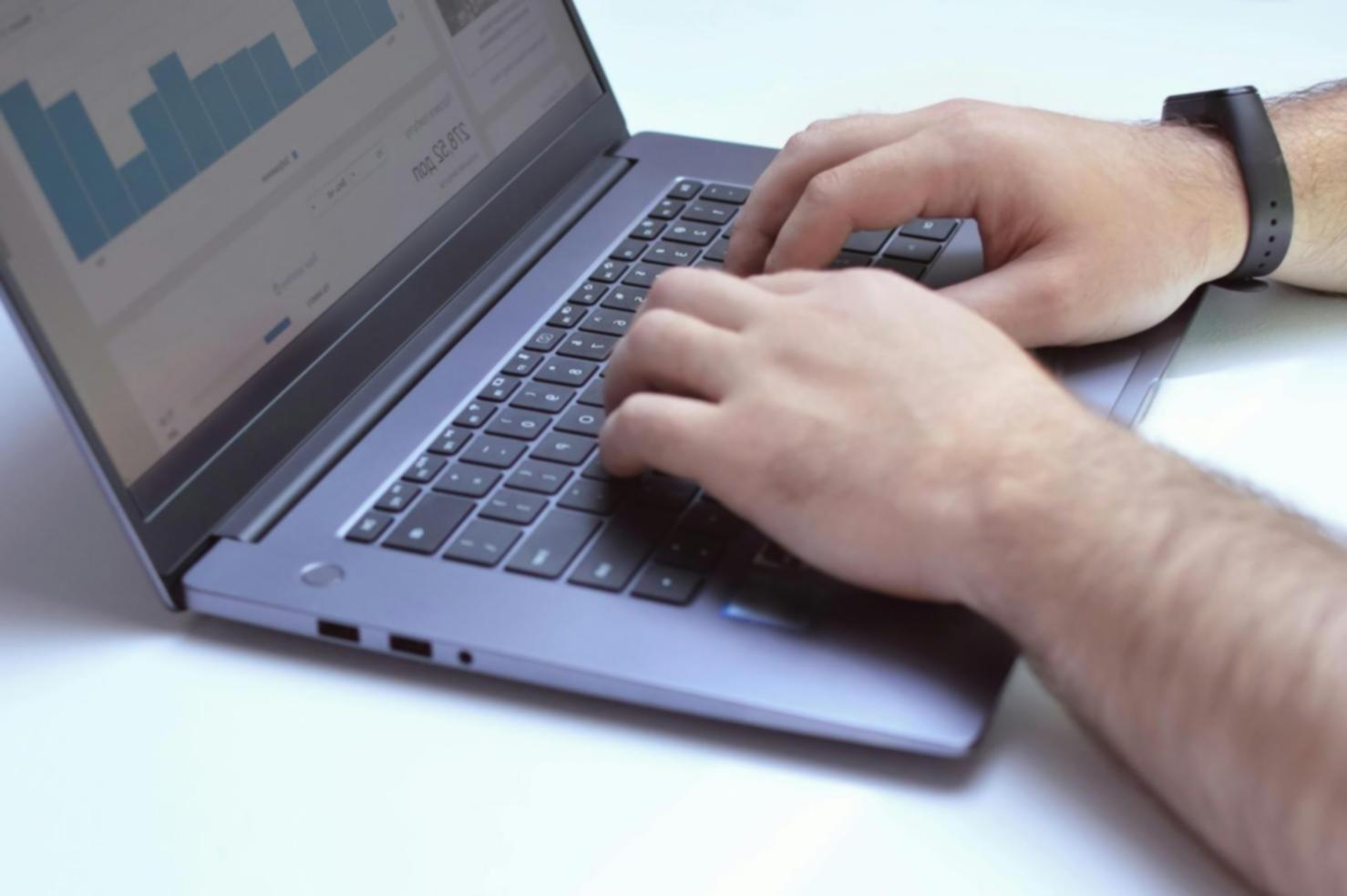 Analyst reviewing blockchain data dashboards on multiple screens